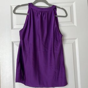 Never worn but without tags sleeveless elegant blouse